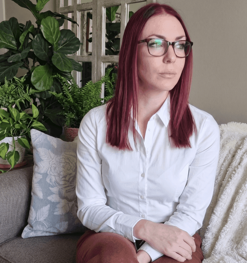 Liezl Swart, HubSpot consultant and founder of CRM Girly, seated in front of houseplants